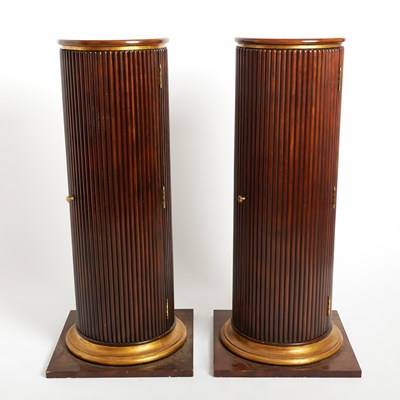 Lot 657 - Pair of Continental Reeded Cylindrical Mahogany Pedestal Cupboards