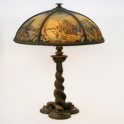Lot 690 - Bradley & Hubbard Reverse-Painted Glass and Patinated Metal Scenic Table Lamp