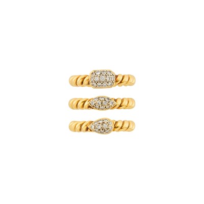 Lot 1106 - Three Two-Color Fluted Gold and Diamond Rings