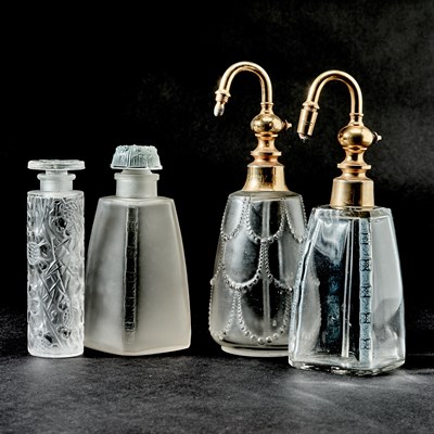 Lot 748 - Four R. Lalique and Lalique Molded Glass Perfume Bottles and Perfume Atomizers