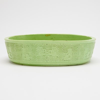 Lot 235 - A Chinese Carved Lime Green Porcelain Narcissus Bowl