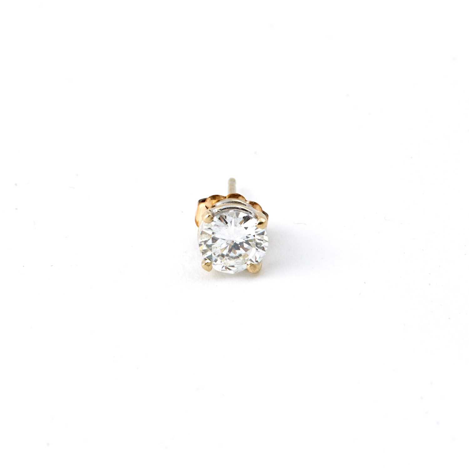 Lot 64 - Diamond Solitaire Earring about 0.75 ct., 14K