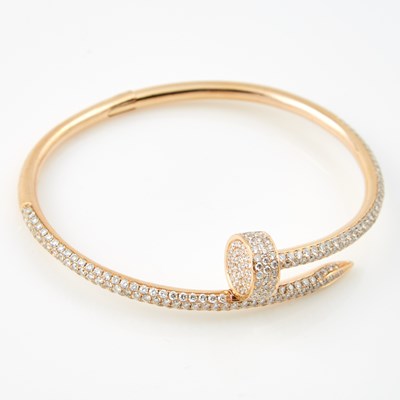Lot 251 - Diamond Rigid Bracelet, 329 diamonds about 3.00 cts., 18K 15 dwt., cartier replica