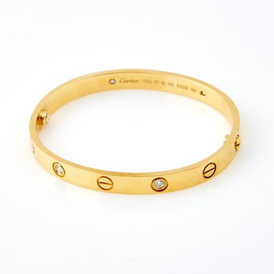 Lot 600 - Diamond Rigid Bracelet, 4 diamonds about 0.30 ct., 18K 19 dwt. with metal screw driver, box and paper, bears signature Cartier