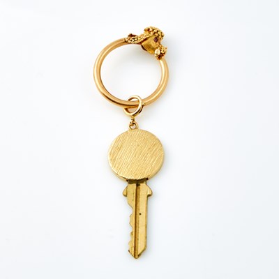 Lot 691 - Gold and Metal Key and Key Holder, 14K and Metal  12 dwt. all
