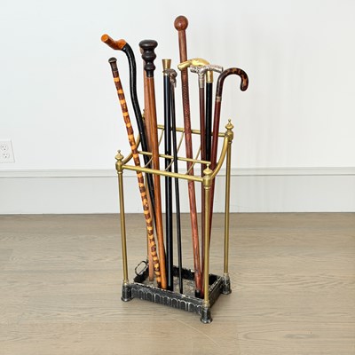 Lot 1083 - Group of Canes and Walking Sticks in a Brass and Iron Stand