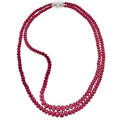 Lot 2292 - Double Strand Ruby Bead Necklace with White Gold and Diamond Clasp