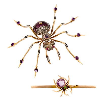 Lot 2214 - Two Gold, Low Karat Gold, Silver, Amethyst, Diamond and Guilloché Enamel Spider Brooches