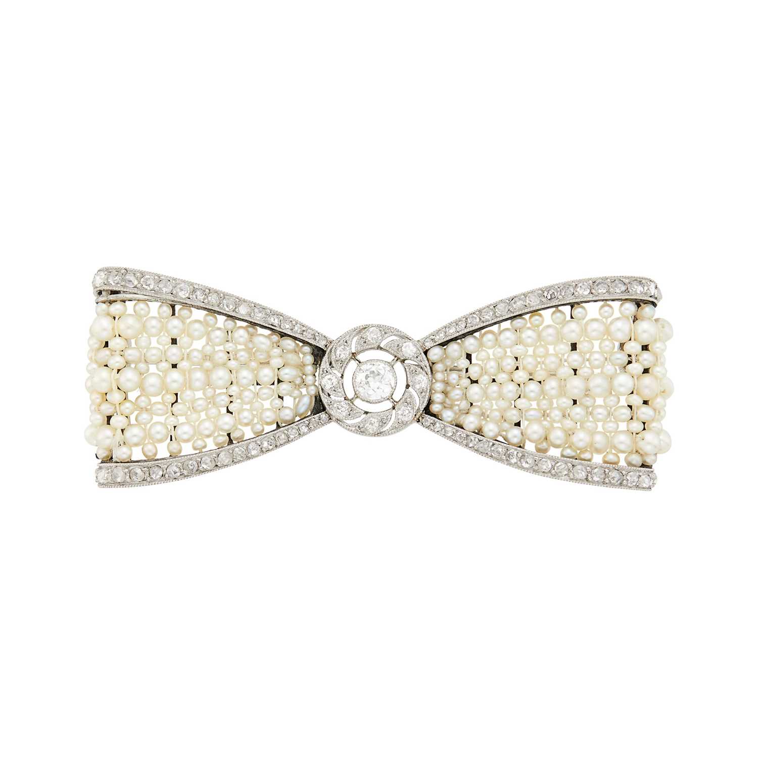 Lot 189 - Cartier Paris Belle Époque Platinum, Seed Pearl and Diamond Bow Brooch