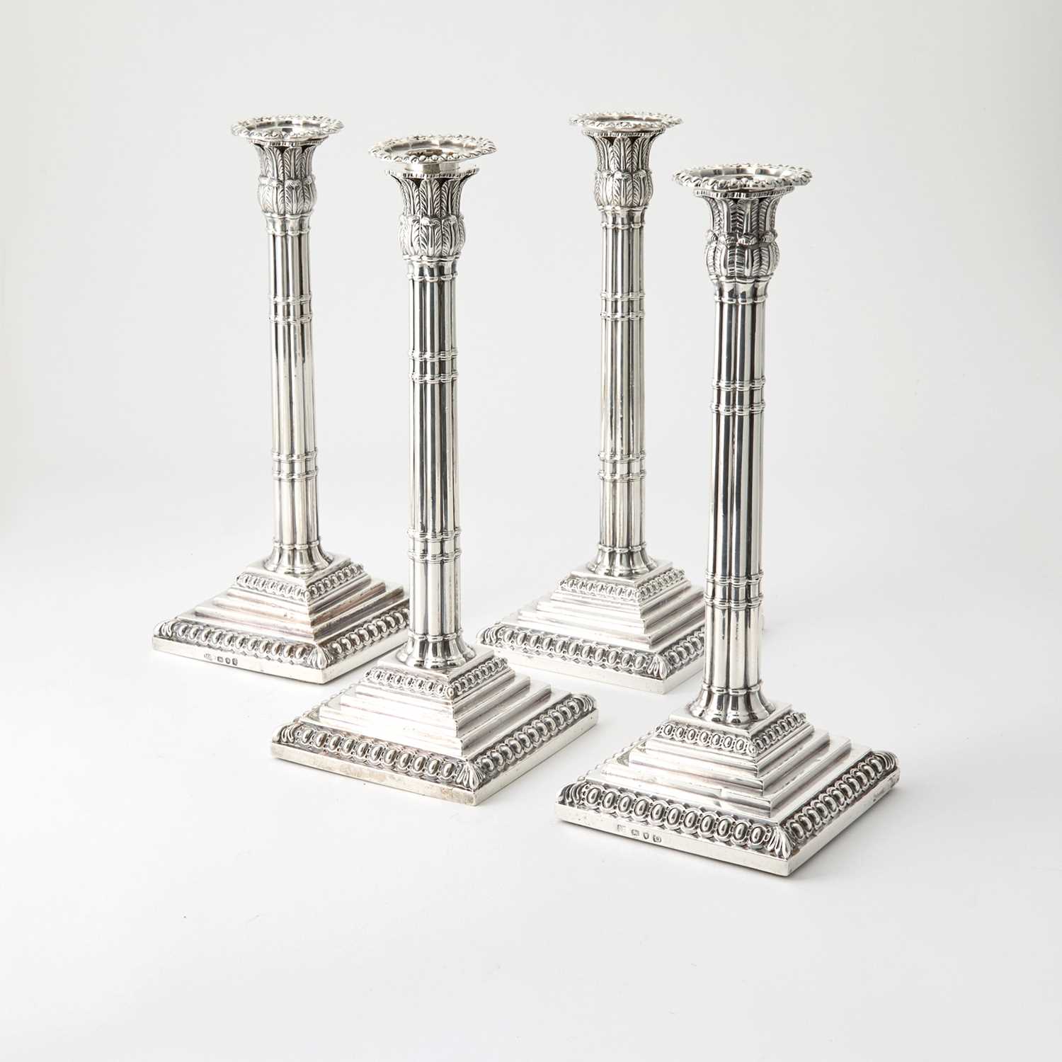 Lot 77 - Assembled Set of Four George III Sterling Silver Candlesticks