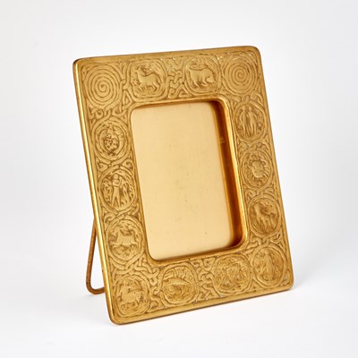 Lot 31 - Tiffany Studios Gilt-Bronze "Zodiac" Pattern Desk Photograph Frame