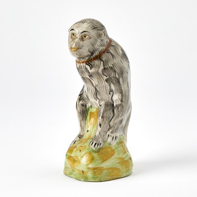 Lot 87 - Staffordshire Figure of a Seated Monkey
