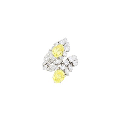 Lot 174 - Platinum, Fancy Intense Yellow Diamond and Diamond Crossover Ring, France