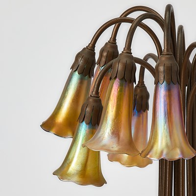 Lot 259 - Tiffany Studios Bronze and Favrile Glass Twelve-Light Pond Lily Lamp
