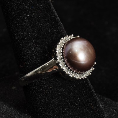 Lot 338 - Low KT White Gold, Diamond and Pearl Ring