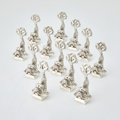 Lot 908 - Set of Twelve Christofle Silver Plated Dolphin Form Place Card Holders