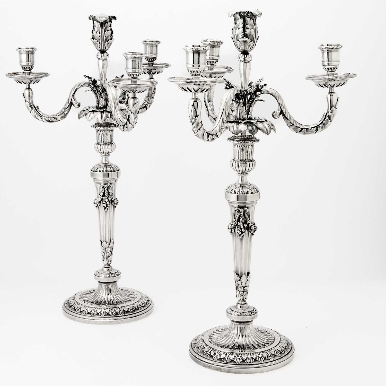 Lot 147 - Pair of French Louis XVI Style Silver Four Light Candelabra