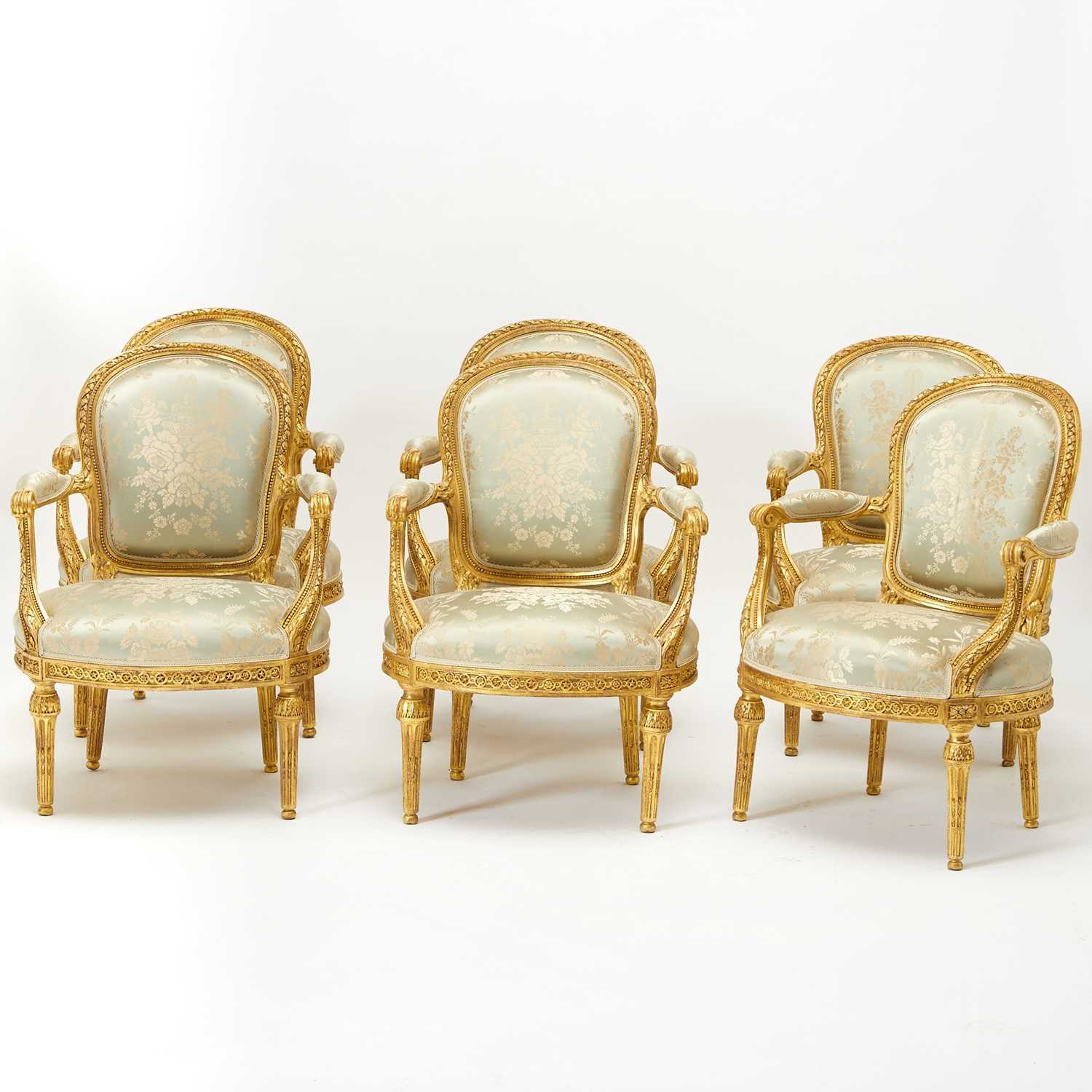 Lot 312 - Set of Six Louis XVI Carved Giltwood Fauteuils en Cabriolet