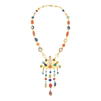 Lot 1122 - Long Gold, Faience, Garnet, Hardstone and Glass Pendant-Brooch Necklace, France