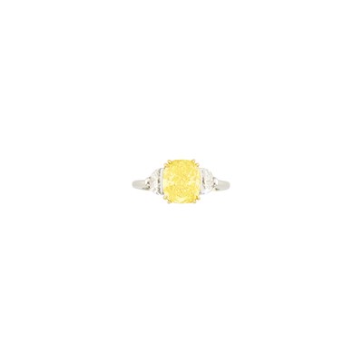 Lot 250 - Platinum, Gold, Fancy Vivid Yellow Diamond and Diamond Ring