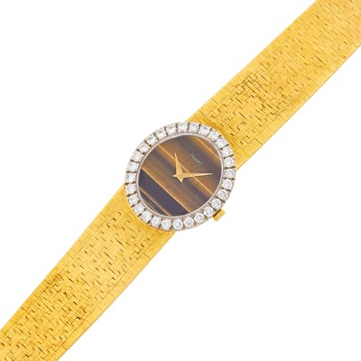 Lot 23 - Piaget Two-Color Gold, Tiger's Eye and Diamond Wristwatch