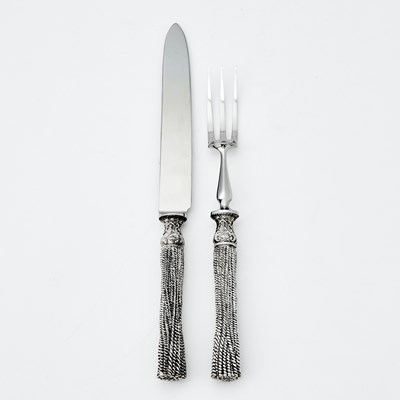 Lot 111 - Christian Lacroix Silvered Metal and Stainless Steel Hot-Meat Carving Knife and Fork Set