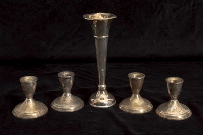 Lot 73 - Set of Four Weighted Sterling Silver Candlesticks