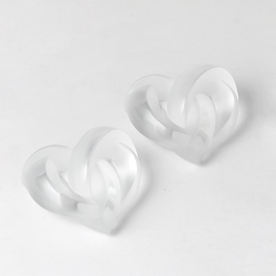 Lot 126 - Two Lalique Molded Glass "Coeurs Entrelaces" Pattern Paperweights