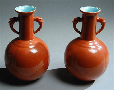 Lot 250 - Pair of Coral-Ground Lobed Bottle Vases...