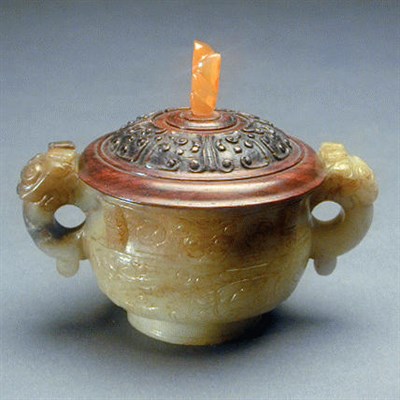 Lot 174 - Archaizing, Mottled Brown and White Jade Gui...