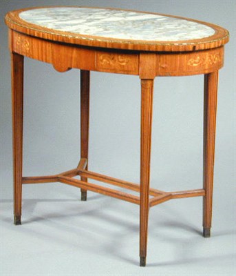 Lot 353 - Edwardian Satinwood Center Table The oval top...