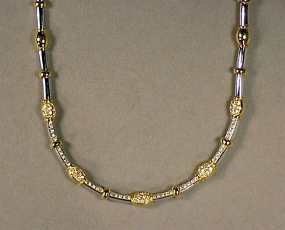 Lot 227 - Two Tone Gold and Diamond Necklace 18 kt....