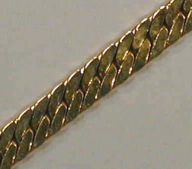 Lot 27 - Gold Chain 14 kt. yellow gold, the flat curb...