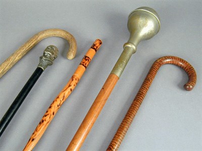 Lot 62 - Group of Four Wood Canes and a Baton