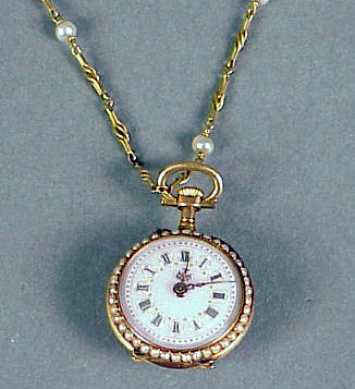 Lot 11 - Diamond and Pearl Lapel Watch and Chain 14 kt....
