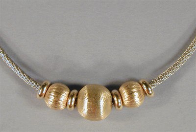 Lot 43 - Gold and Silver Necklace The woven silver band...