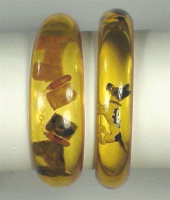 Lot 305 - Two Bakelite Reverse Carved and Painted...
