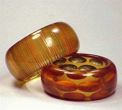 Lot 294 - Two Bakelite Reverse Carved and Painted...