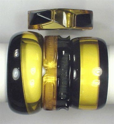Lot 605 - Group of Four Bakelite Two-Tone Bracelets Each...