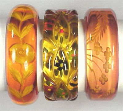 Lot 272 - Group of Three Bakelite Reverse Carved...