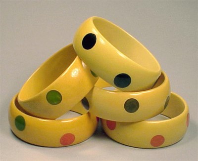 Lot 360 - Group of Five Bakelite Dot Bracelets Each in...