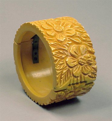 Lot 302 - Bakelite Hinged Bracelet With floral carved...