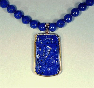 Lot 201 - Lapis Bead Necklace and Pendant The single...