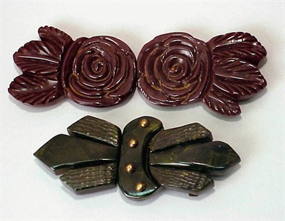 Lot 517 - Two Bakelite Belt Buckles One with carved...