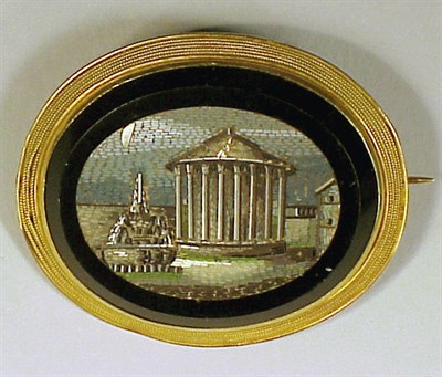 Lot 216 - Gold and Micromosaic Brooch The 18 kt. yellow...
