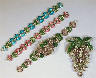 Lot 163 - Trifari Flower Pin and Three Bracelets The pin...