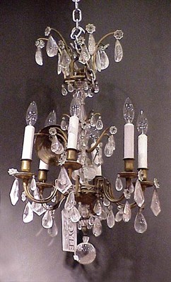 Lot 631 - Rococo Style Brass and Rock Crystal Six-Light...