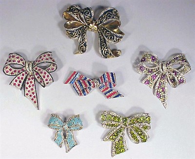 Lot 161 - Six Rhinestone Bow Pins Various colors and...