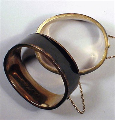 Lot 215 - Pair of Gold and Enamel Bangle Bracelets 14 kt....