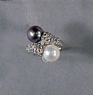 Lot 341 - Cultured Pearl and Diamond Crossover Ring 14...